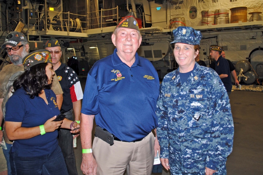 Commander and a Master Chief Petty Officer (E-9)