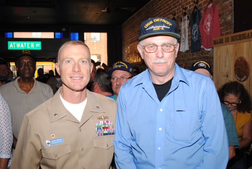 Commander Desmond and a crewmember from the last ship named after Detroit